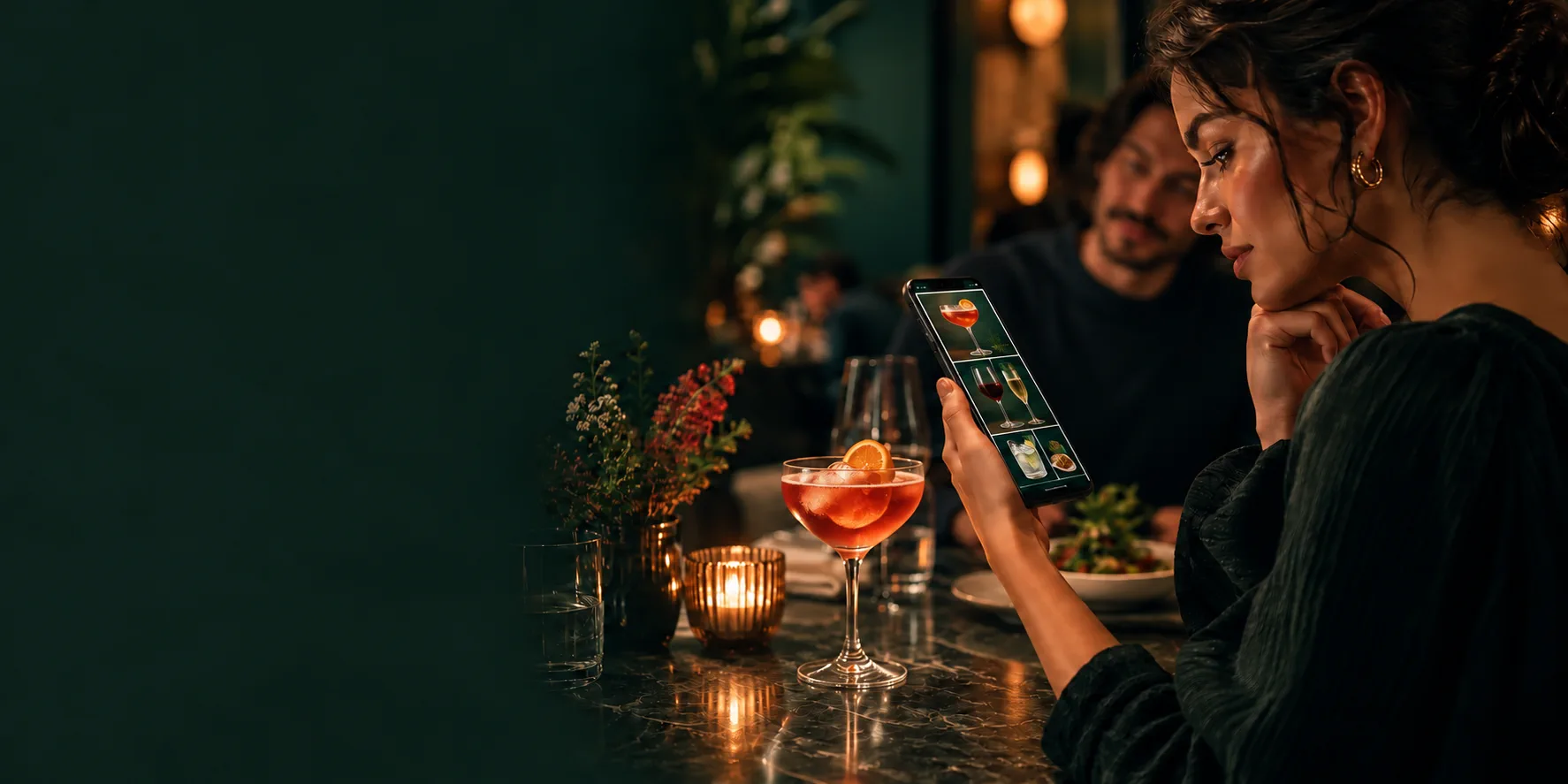 Restaurant customer focused on choosing cocktails and beverages from the digital menu